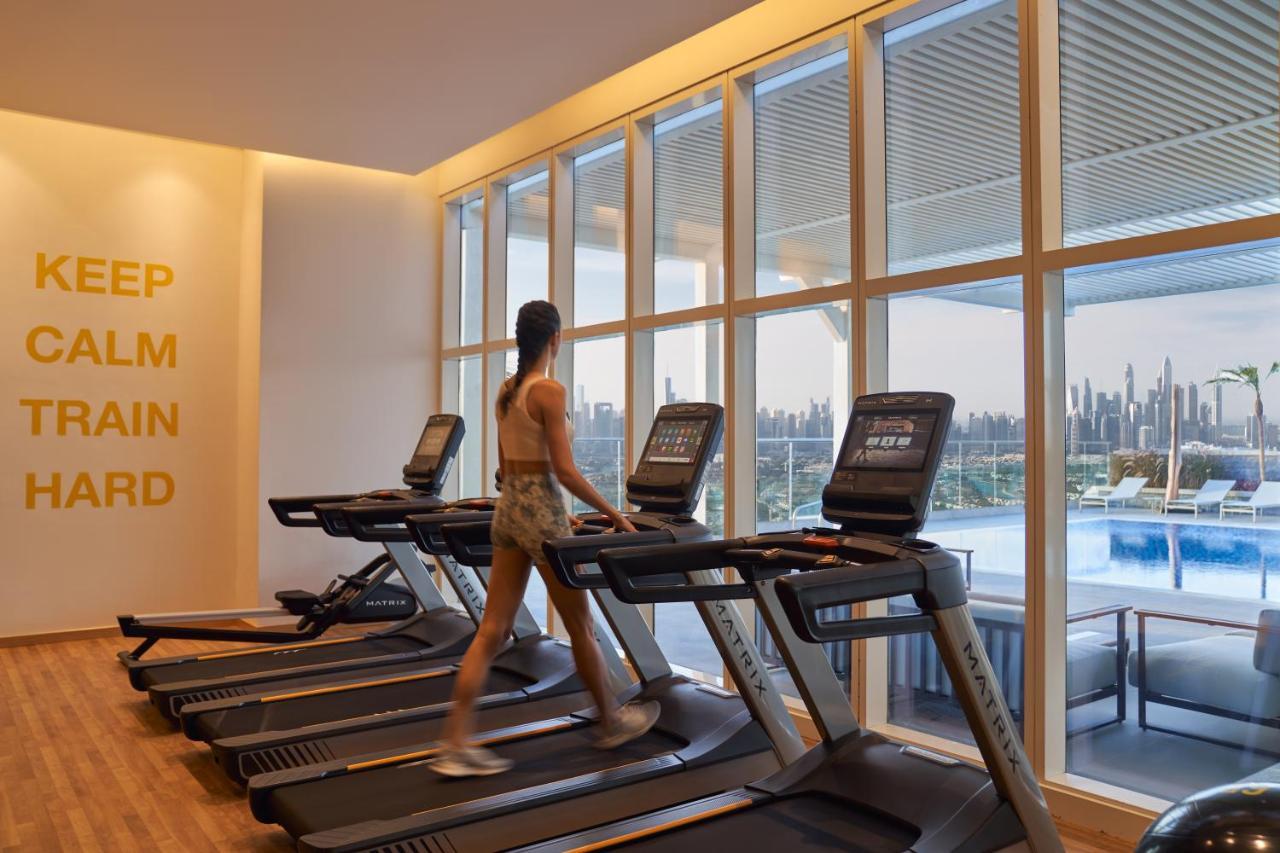Movenpick Jumeirah Village Triangle دبي المظهر الخارجي الصورة The gym at the hotel