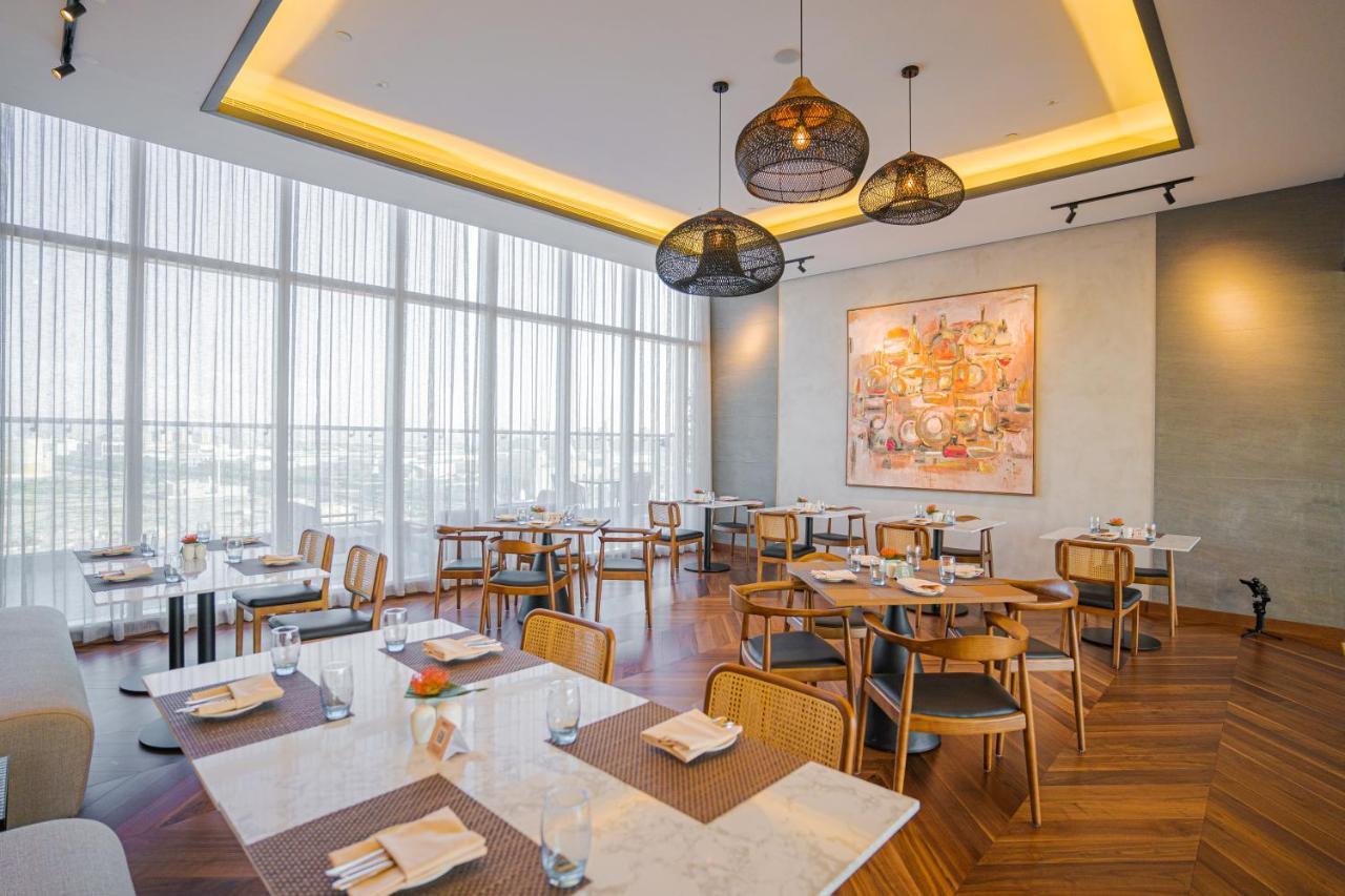 Movenpick Jumeirah Village Triangle دبي المظهر الخارجي الصورة The restaurant