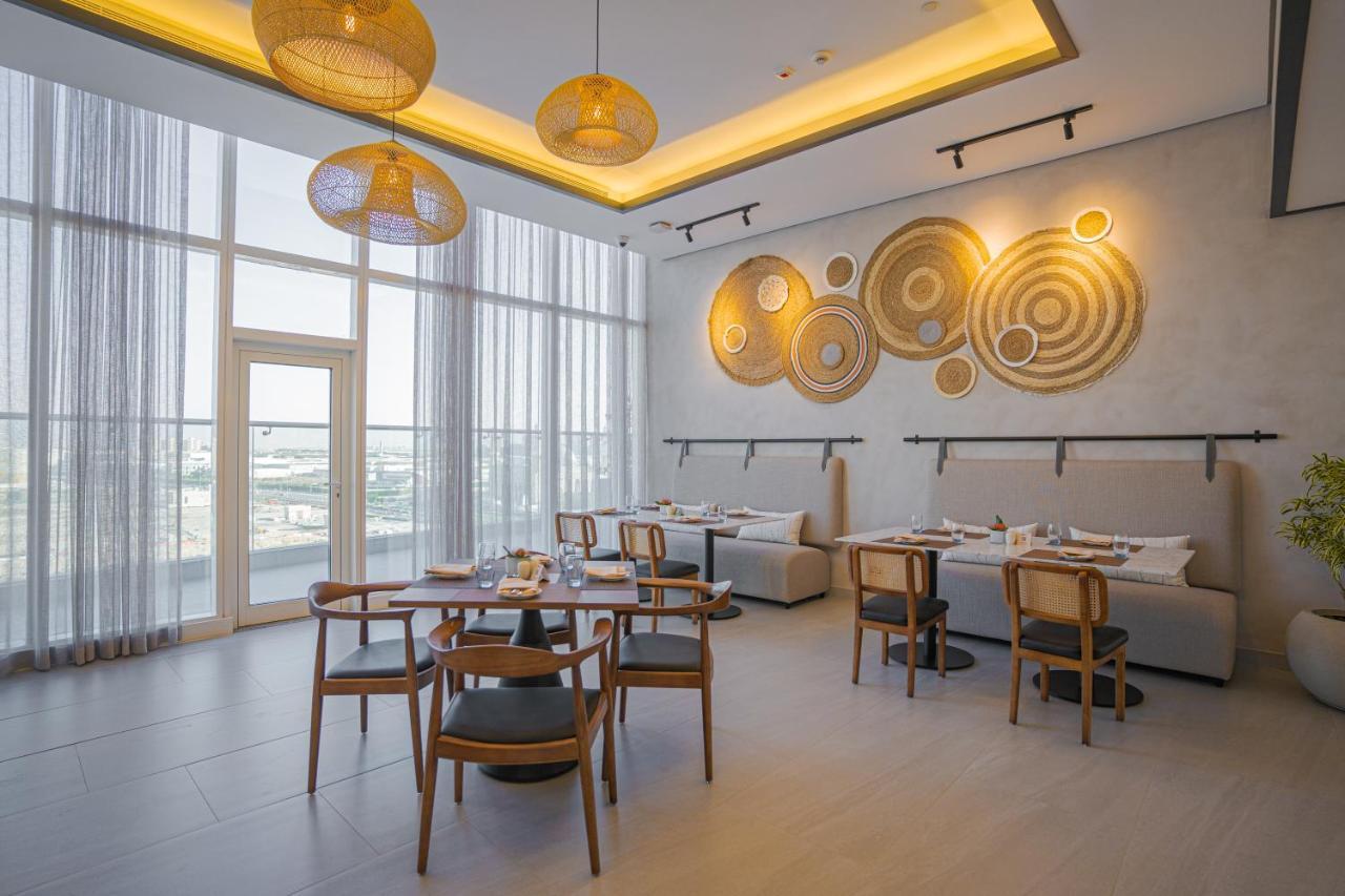 Movenpick Jumeirah Village Triangle دبي المظهر الخارجي الصورة The restaurant