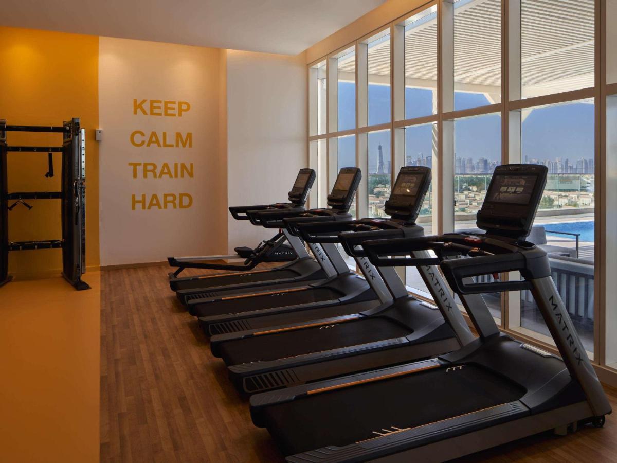 Movenpick Jumeirah Village Triangle دبي المظهر الخارجي الصورة The gym at the hotel