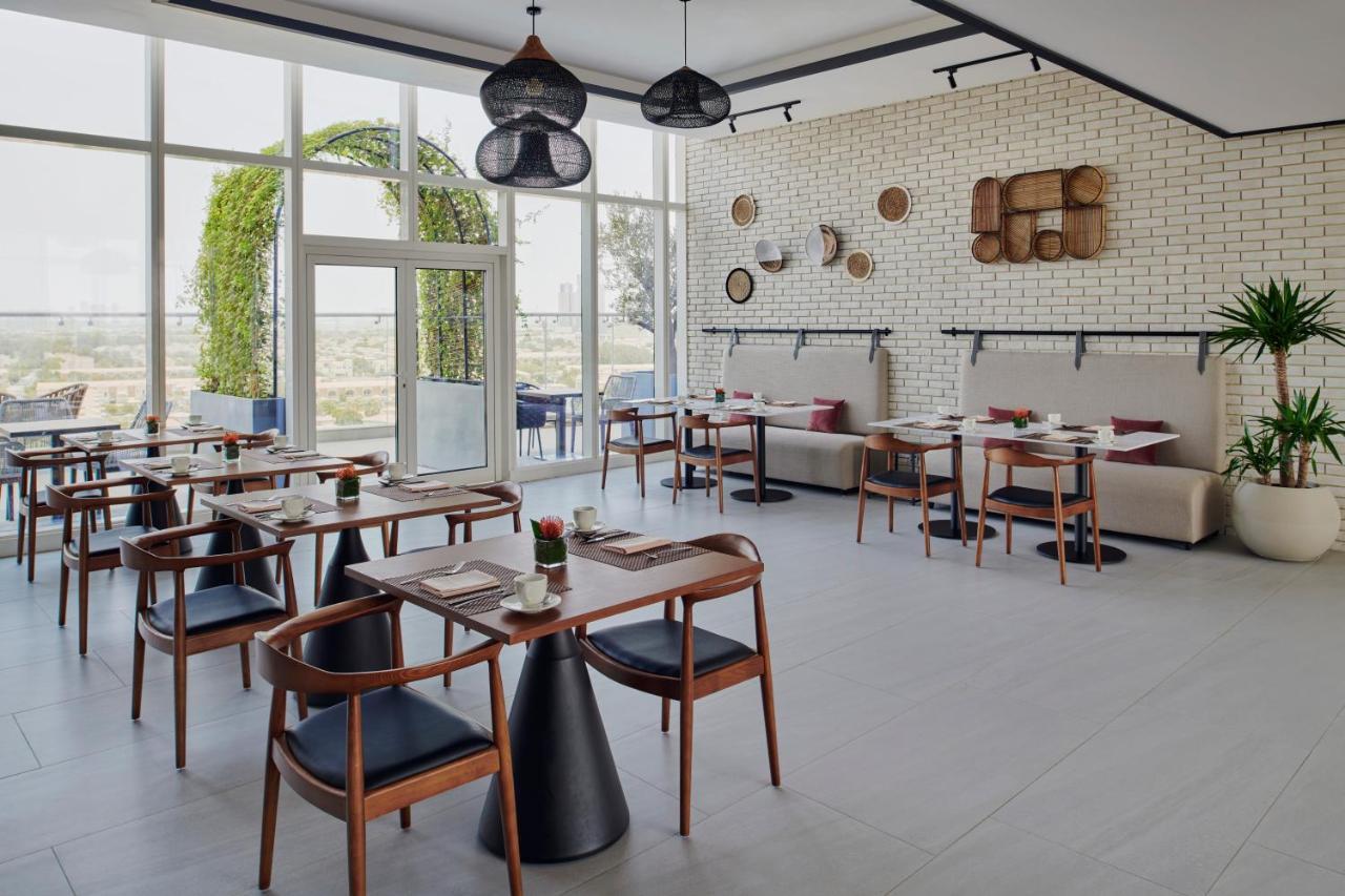 Movenpick Jumeirah Village Triangle دبي المظهر الخارجي الصورة Restaurant
