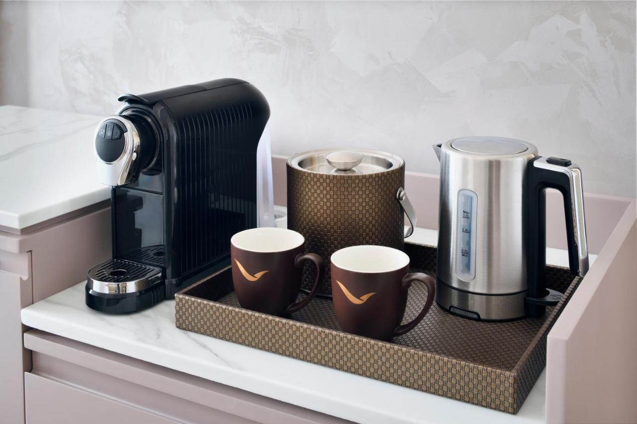 Movenpick Jumeirah Village Triangle دبي المظهر الخارجي الصورة A Nespresso coffee machine